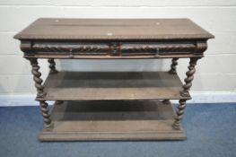 A VICTORIAN CARVED OAK THREE TIER BUFFET, the top shelf with a hinged top enclosing a marble insert,