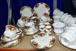 TWO ROYAL ALBERT TEA SETS, 'MEMORY LANE' AND 'OLD COUNTRY ROSES' PATTERNS, comprising eight cups,