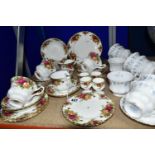 TWO ROYAL ALBERT TEA SETS, 'MEMORY LANE' AND 'OLD COUNTRY ROSES' PATTERNS, comprising eight cups,