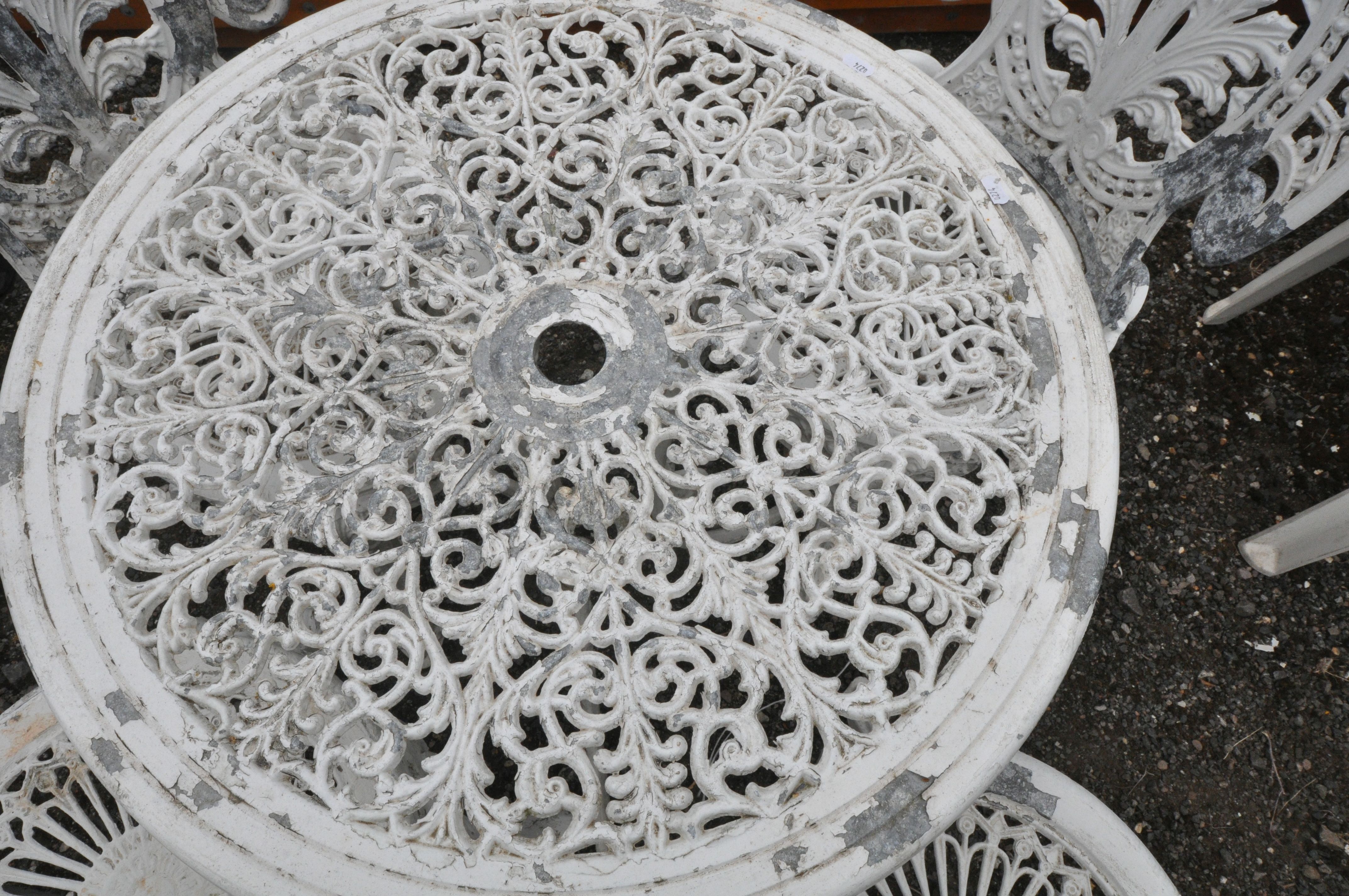 A WHITE PAINTED CAST ALUMINIUM CIRCULAR GARDEN TABLE, diameter 69cm x height 66cm, along with four - Image 2 of 4