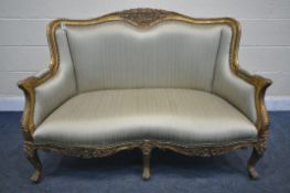A FRENCH LOUIS XV STYLE GILT WOOD SOFA, with foliate decoration, with six legs, length 127cm x depth