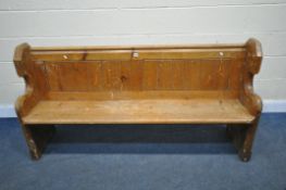 A STAINED PINE CHURCH PEW, length 178cm x depth 49cm x height 90cm (condition:-aged wear and tear,