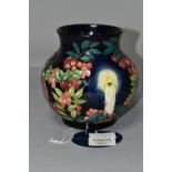 A MOORCROFT POTTERY LIMITED EDITION 'GUIDING LIGHT' VASE, numbered 32/50, tube lined with candles,