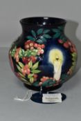 A MOORCROFT POTTERY LIMITED EDITION 'GUIDING LIGHT' VASE, numbered 32/50, tube lined with candles,