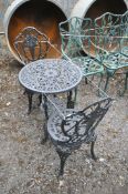 A BLACK PAINTED ALUMINIUM CIRCULAR GARDEN TABLE AND TWO CHAIRS, diameter 60cm x height 66cm (