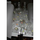 A GROUP OF CUT GLASS DECANTERS AND WATERFORD CRYSTAL, comprising a Waterford Crystal mantel clock, a