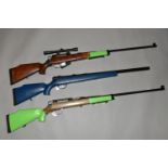 THREE BB BOLT ACTION SPRING OPERATED AIR RIFLES, one fitted with a scope, all cock and discharge,