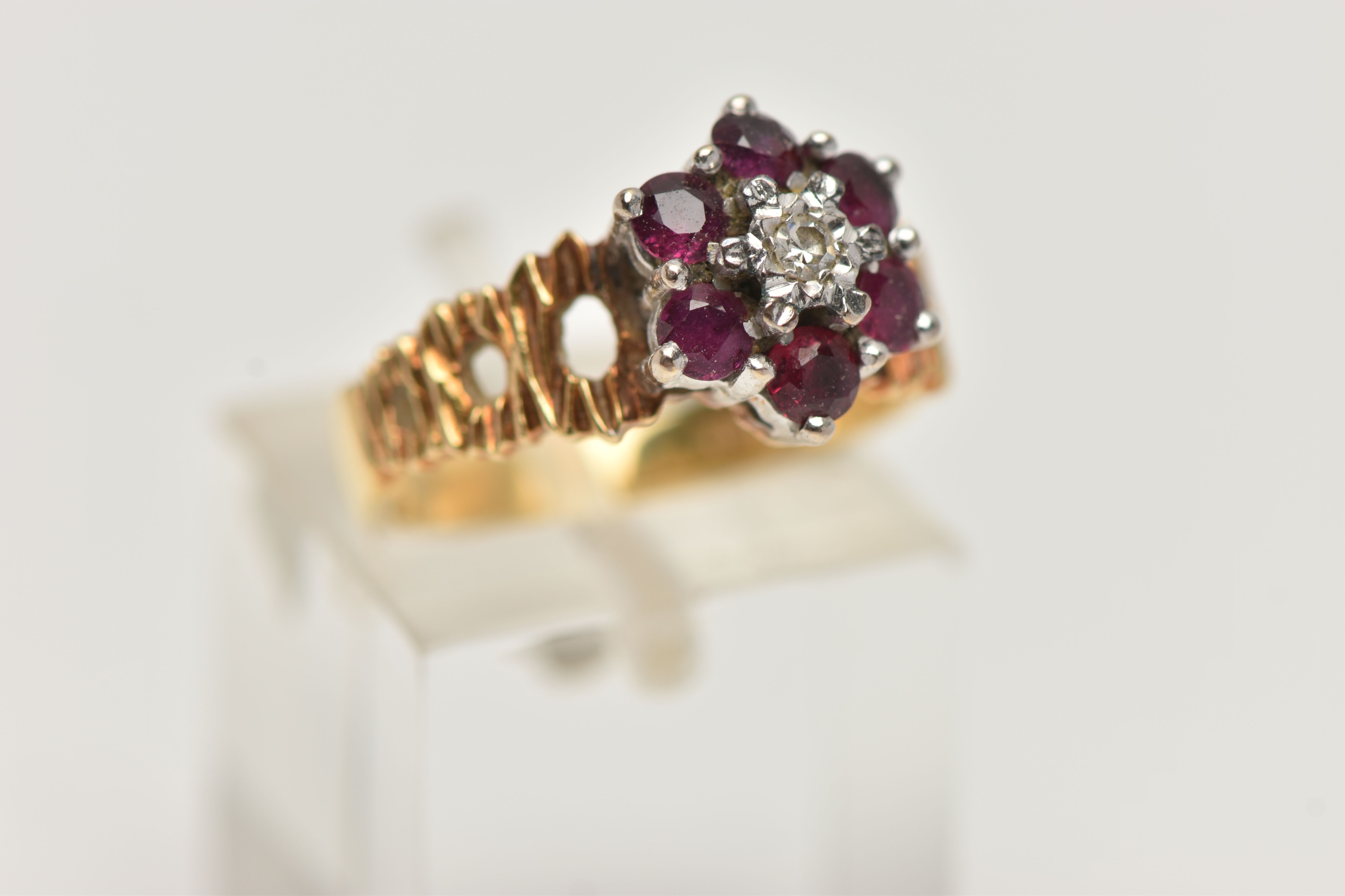 A YELLOW METAL DIAMOND AND RUBY CLUSTER RING, centrally set with a single cut diamond illusion - Image 4 of 4