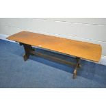 A RECTANGULAR OAK TRESTLE COFFEE TABLE, length 137cm x depth 40cm x height 42cm (condition:-water