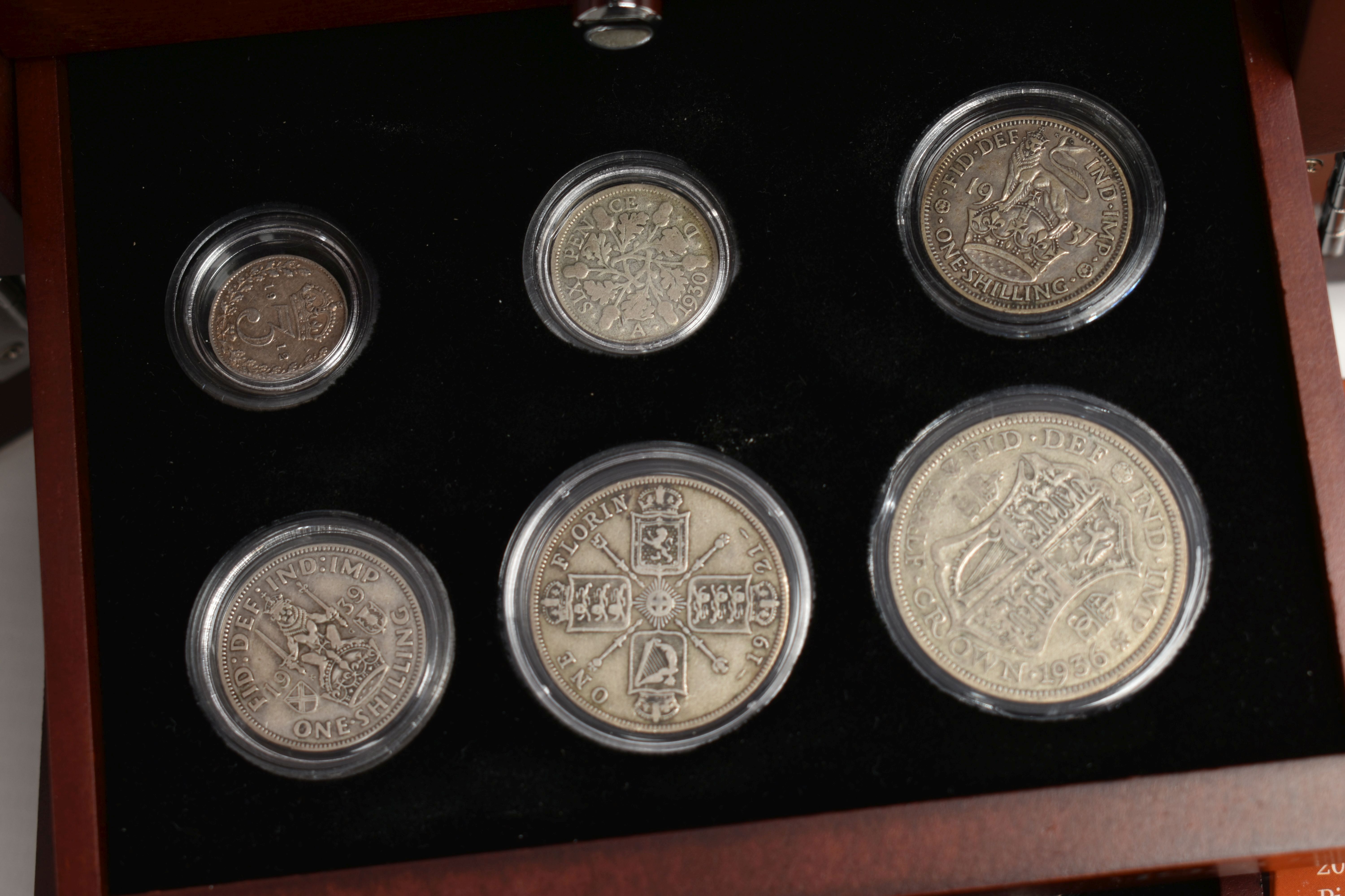 A GLAZED DISPLAY BOX THREE DECADES of GEORGE V STAMP AND COIN SET, to include four trays of silver - Image 12 of 18