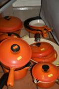 A COLLECTION OF LE CREUSET SAUCEPANS AND COOKWARES, comprising a covered 23cm saucepan, two