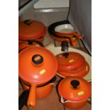 A COLLECTION OF LE CREUSET SAUCEPANS AND COOKWARES, comprising a covered 23cm saucepan, two