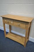 A MODERN LIGHT OAK SIDE TABLE, with two drawers, width 85cm x depth 36cm x height 78cm (condition:-