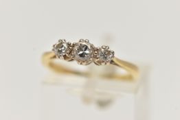 A YELLOW METAL THREE STONE DIAMOND RING, designed with three claw set, round brilliant cut diamonds,