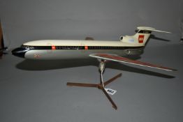 A FIBREGLASS MODEL OF A BEA AEROPLANE, white, red, blue and silver livery, mounted on a perspex