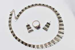 A 9CT GOLD SYNTHETIC SAPPHIRE RING AND A MATCHING SILVER NECKLACE AND EARRING SET, circular cut