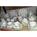 TWO PARAGON TEA SETS, comprising a twenty four piece tea set printed and tinted with butterflies,