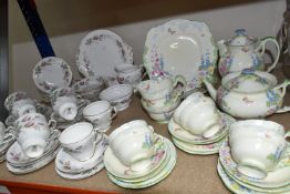 TWO PARAGON TEA SETS, comprising a twenty four piece tea set printed and tinted with butterflies,