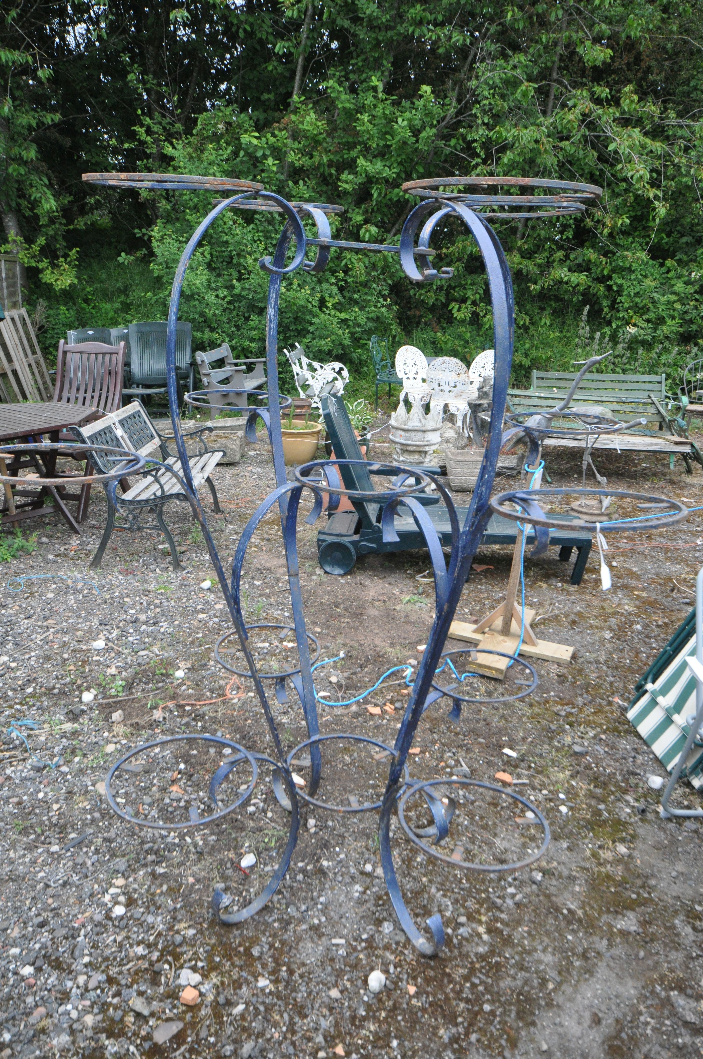 A FRENCH WROUGHT IRON PLANTER STAND, with fifteen pot holders, ideal to be used a feature display,