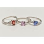 THREE 9CT WHITE GOLD GEM SET RINGS, to include a garnet and diamond ring, ring size N, a tanzanite