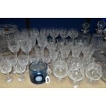 A GROUP OF CUT CRYSTAL DECANTERS, STUART CRYSTAL PUNCH SET AND DRINKING GLASSES, comprising a pair