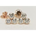 A PAIR OF 6 CARAT DIAMOND STUD EARRINGS, each earring comprising of three round brilliant cut