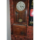A GLEDHILL-BROOK TIME RECORDERS OF HUDDERSFIELD VINTAGE CLOCKING MACHINE in oak case with two