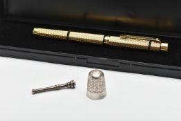 A GOLD PLATED 'SHEAFFER' FOUNTAIN PEN A THIMBLE AND TOOTHPICK, gold plated engine turned pattern