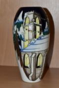 A MOORCROFT POTTERY LIMITED EDITION 'CHRISTMAS WELCOME' VASE, tube lined with a church and trees