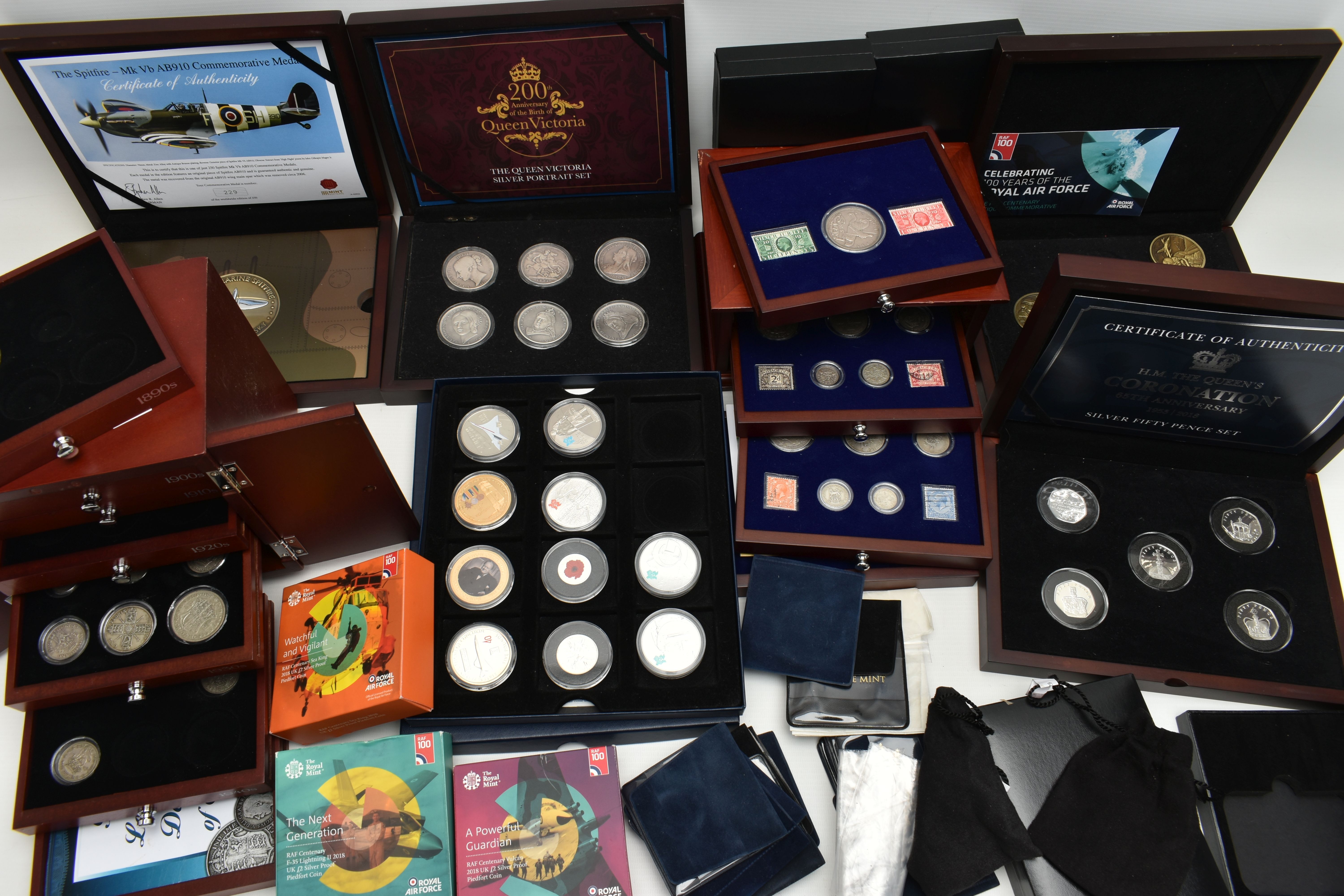 A GLAZED DISPLAY BOX THREE DECADES of GEORGE V STAMP AND COIN SET, to include four trays of silver - Image 2 of 18