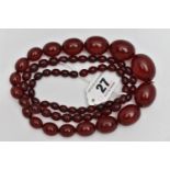 A GRADUATED BAKELITE BEAD NECKLACE, comprising of sixty-nine beads measuring approximately 9mm to