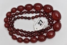 A GRADUATED BAKELITE BEAD NECKLACE, comprising of sixty-nine beads measuring approximately 9mm to
