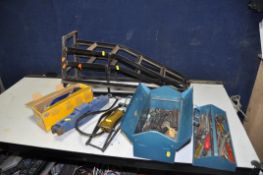 A SELECTION OF AUTOMOTIVE TOOLS, to include a pair of car ramps, two foot pumps, a scissor jack