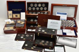 A LARGE AND HEAVY BOX OF CASED UK COINAGE, to include the complete Shilling collection (58) 29