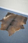 A HANLIN SOUTH AMERICAN NATURAL COWHIDE RUG, 160cm x 171cm (condition:-stitched repair to one