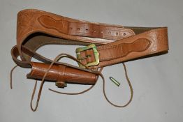 A GOOD QUALITY HEAVILY TOOLED GUN BELT AND HOLSTER, with a number of inert cartridges