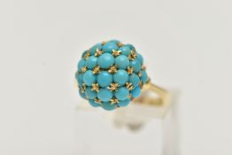 A YELLOW METAL TURQUOISE DOME RING, circular dome set with turquoise cabochons, raised on an open