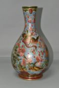 AN ORIENTAL VASE, decorated with pink cranes and blossom on a pale blue ground, outlined in gold