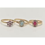 THREE 9CT GOLD GEM SET RINGS, to include a topaz and diamond cluster, ring size O, a ruby and