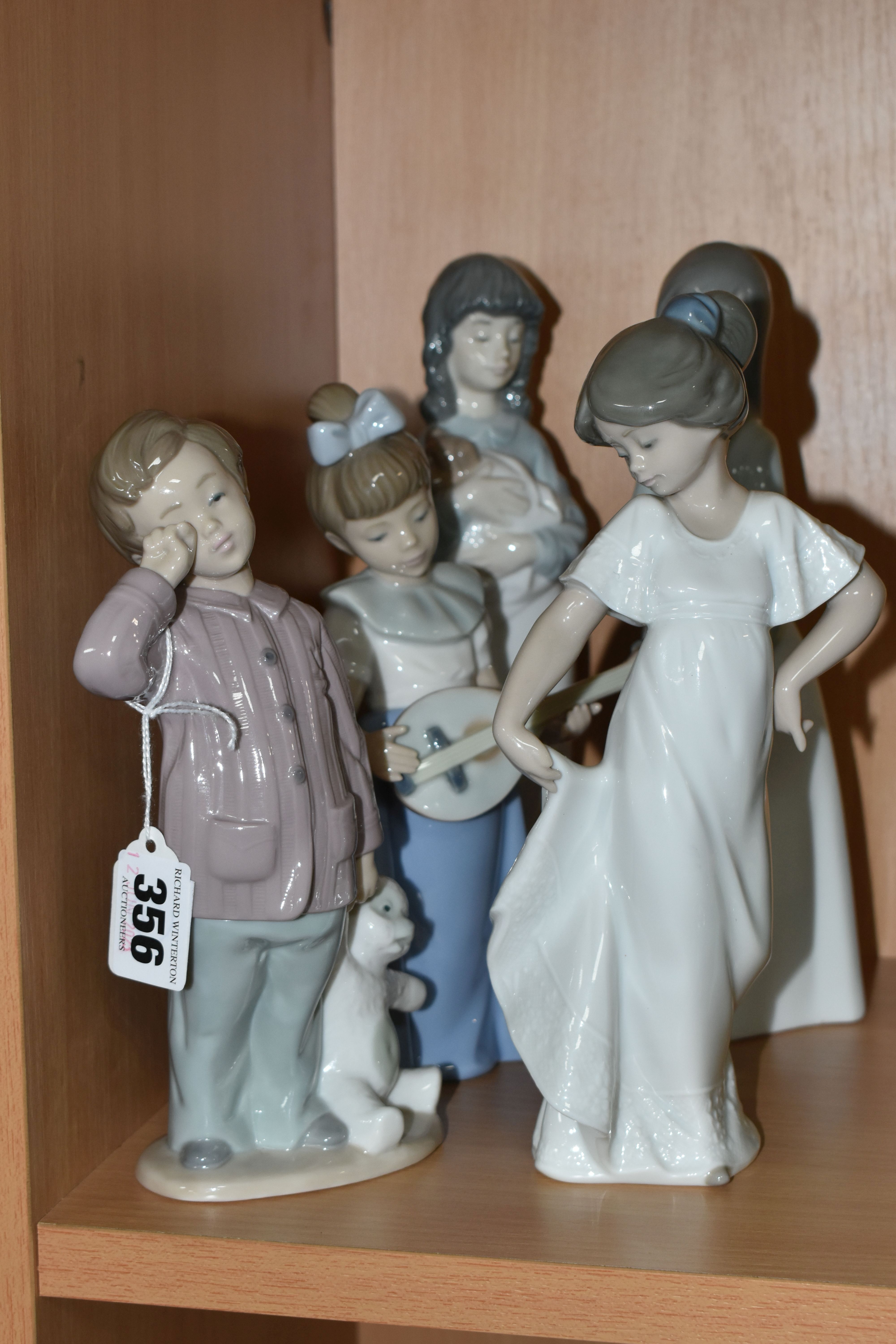 FIVE NAO BY LLADRO FIGURINES, comprising 'Sleepy Head' 1139, 'Girl With A Mandolin', 'How Pretty'