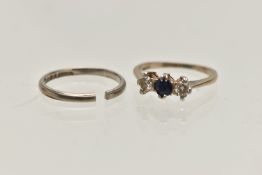 AN 18CT WHITE GOLD BAND AND A THREE STONE RING, the AF polished thin band (split shank),