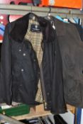 A GROUP OF CLOTHING, comprising two brown John Partridge waxed jackets, one labelled ladies size