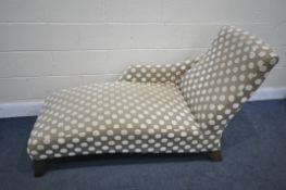 A SPOTTED UPHOLSTERED CHAISE LONGUE, length 160cm