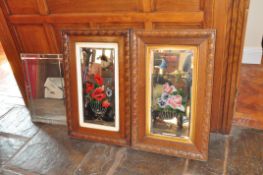 A PAIR OF EDWARDIAN PAINTED MIRRORS with oak frames and floral painted detail to bevelled looking