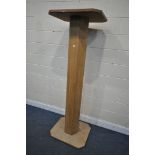 A TALL OAK AND PLYWOOD TORCHERE STAND, height 192cm