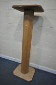 A TALL OAK AND PLYWOOD TORCHERE STAND, height 192cm