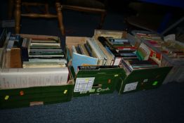 FOUR BOXES OF BOOKS AND MAPS, containing over 100 book titles in hardback and paperback formats,
