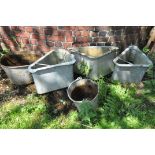 FIVE VINTAGE GALVANISED ITEMS including three quadrant water feeders 68cm across, a tub and a