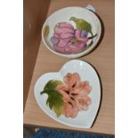 TWO MOORCROFT DISHES, one small dish decorated with a pink magnolia flower on a cream ground, a