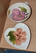 TWO MOORCROFT DISHES, one small dish decorated with a pink magnolia flower on a cream ground, a